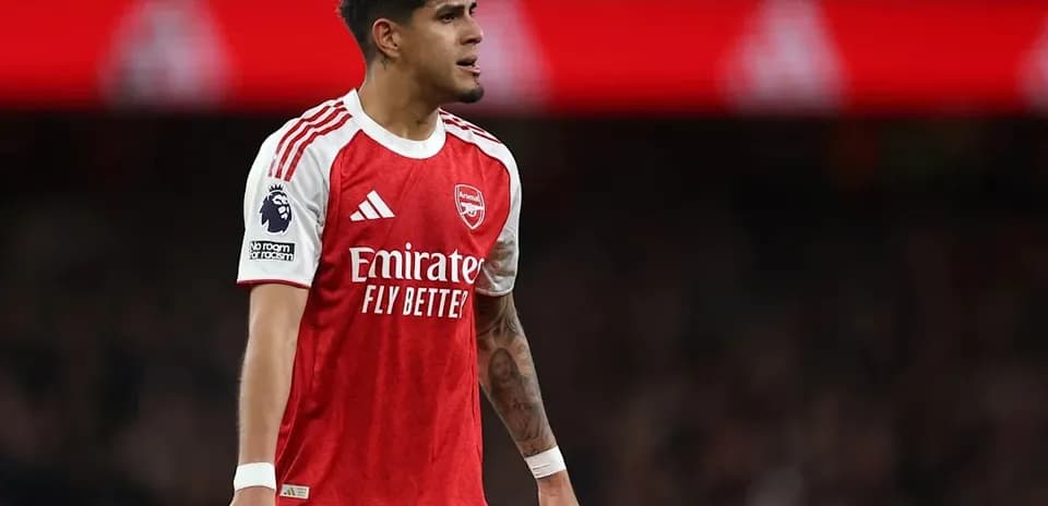 Arsenal player in red jersey during match