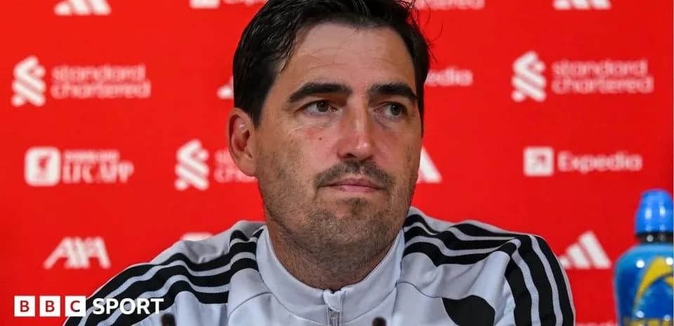 Manager at press conference with sponsors backdrop