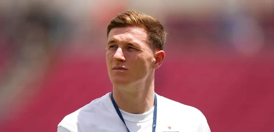 Player wearing England kit on the field