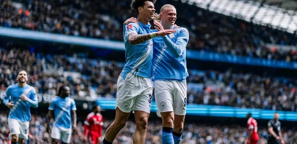 Manchester City players celebrating a goal in match