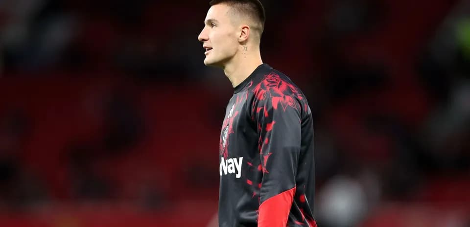 Goalkeeper warming up on the pitch before match