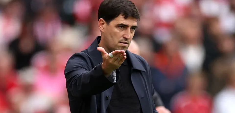Coach gesturing during a football match