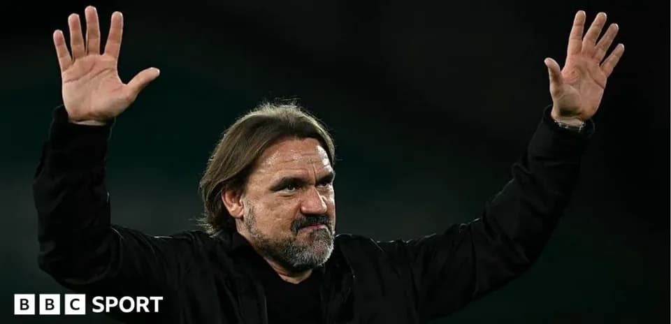 Manager gesturing with hands during match celebration