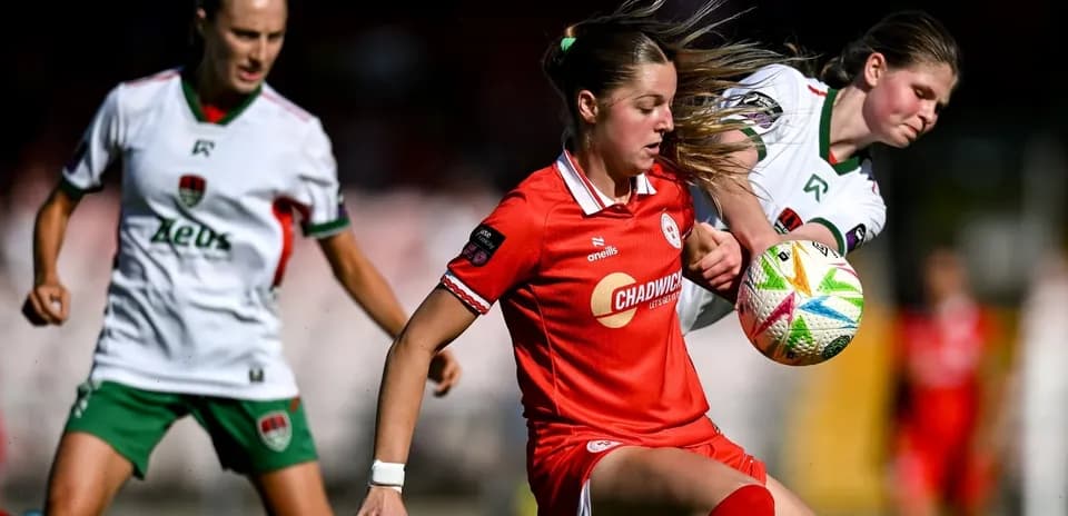 Two players contesting for the ball during match