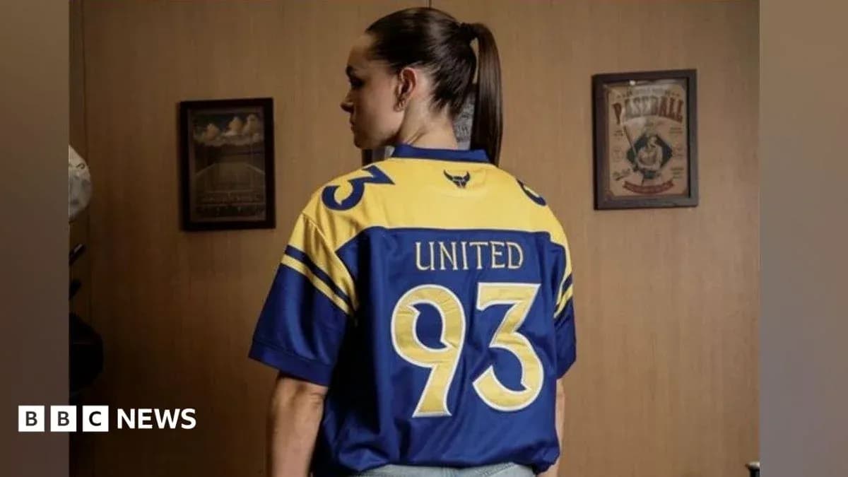 Person wearing a blue and yellow sports jersey
