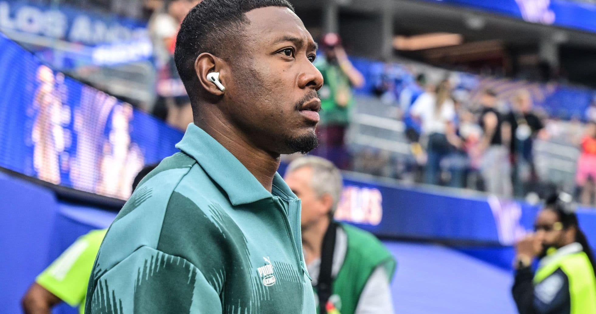 Player walking through stadium before the match