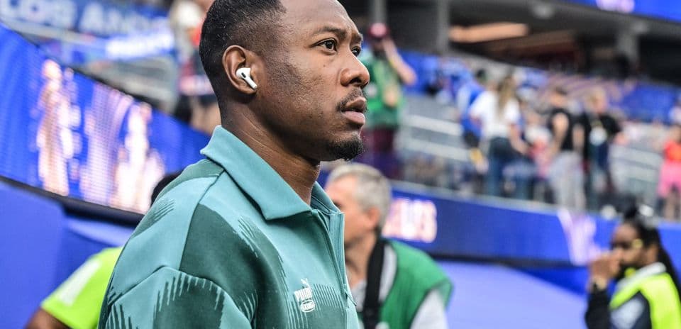 Player walking through stadium before the match