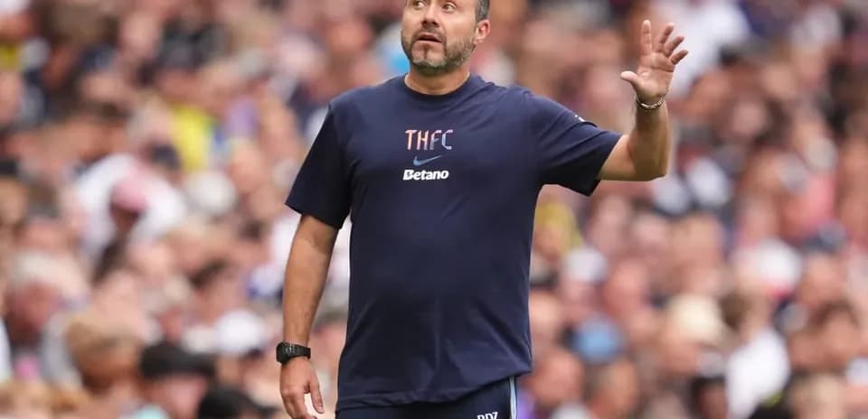 Manager gesturing during match on the sideline