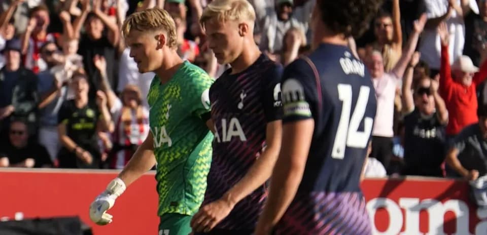 Tottenham players walking past celebrating fans