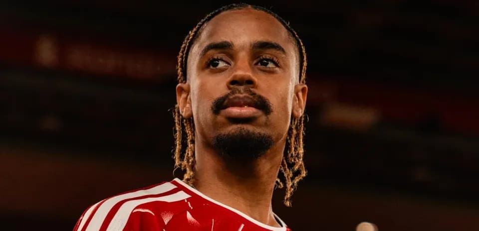Player in red jersey posing for portrait