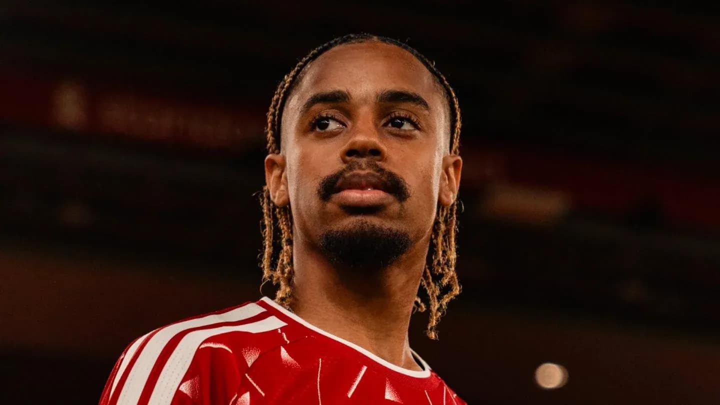 Player in red jersey posing for portrait