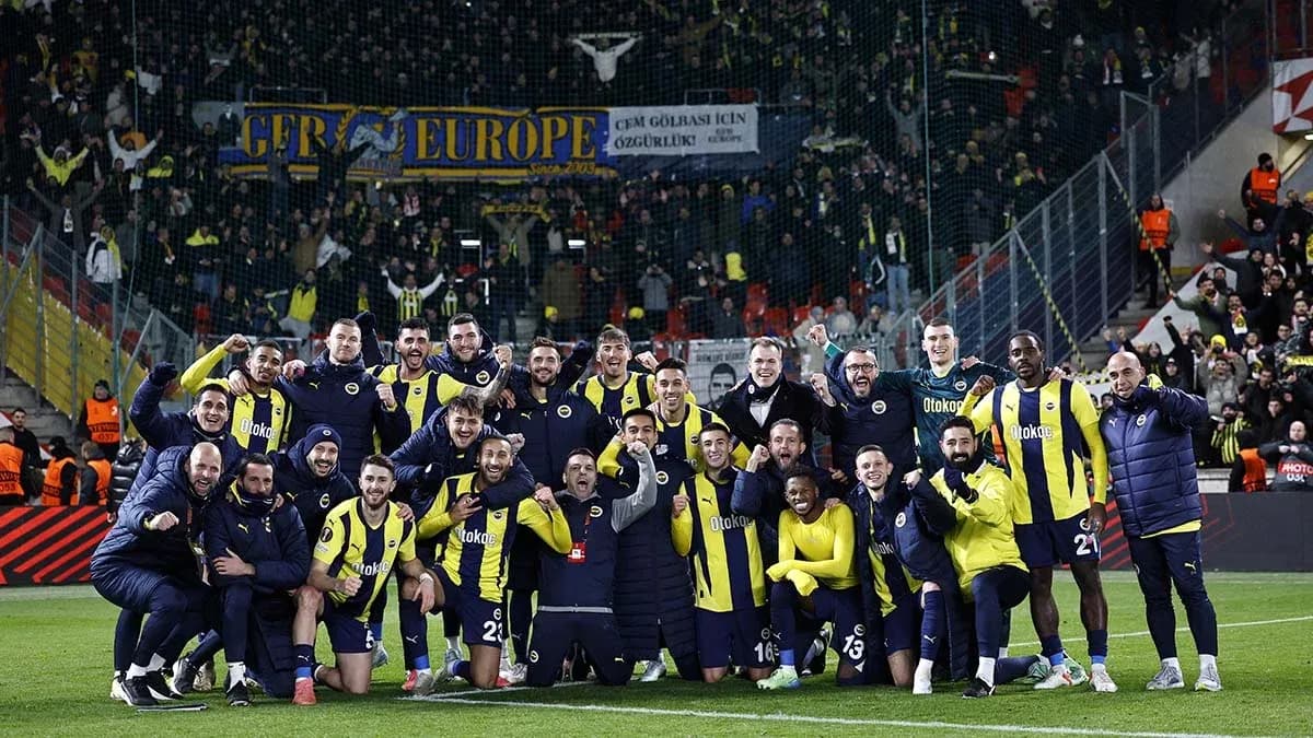 Fenerbahçe team celebrating with fans in stadium