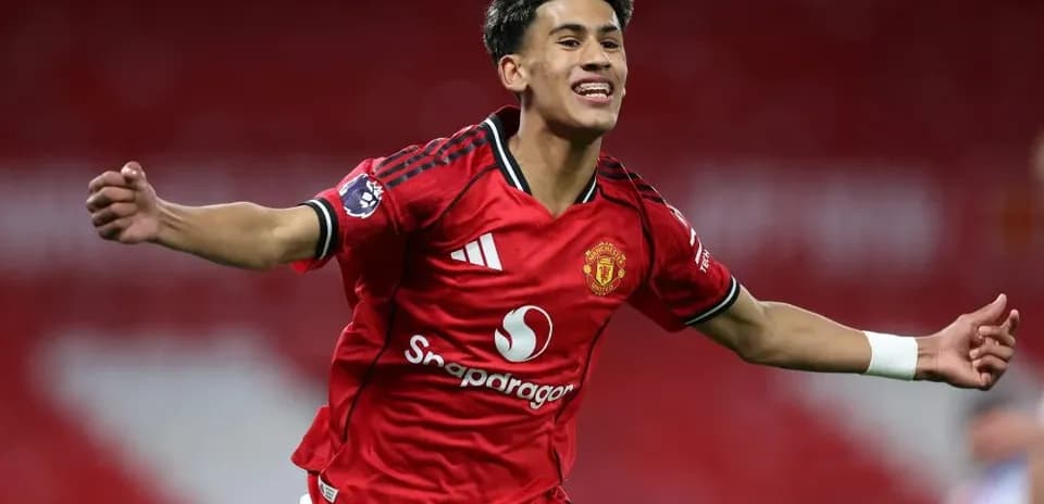 Player celebrating a goal in Manchester United jersey