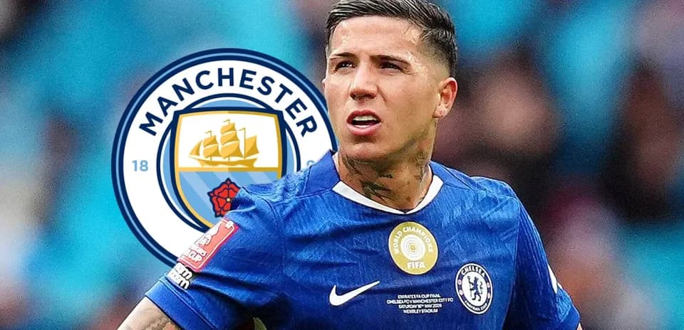 Player in blue jersey with Manchester City logo background