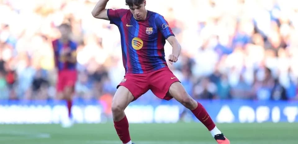 Player dribbling the ball on the pitch