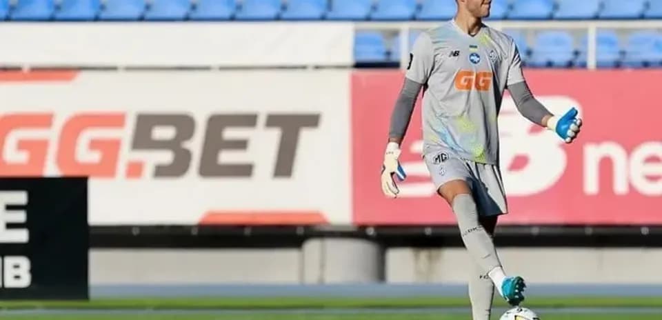 Goalkeeper practicing with ball on the field