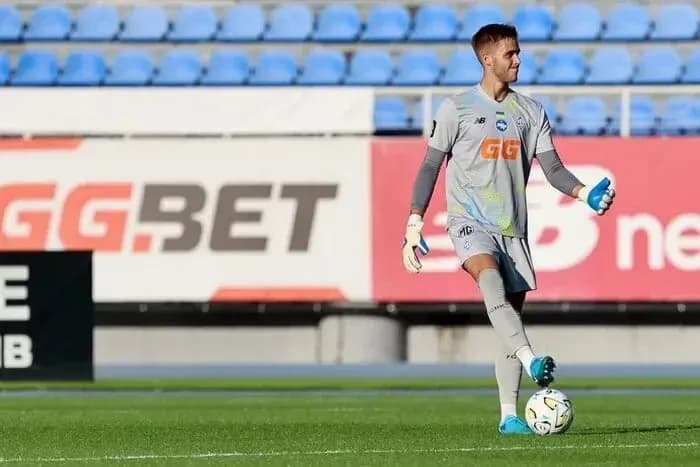 Goalkeeper practicing with ball on the field