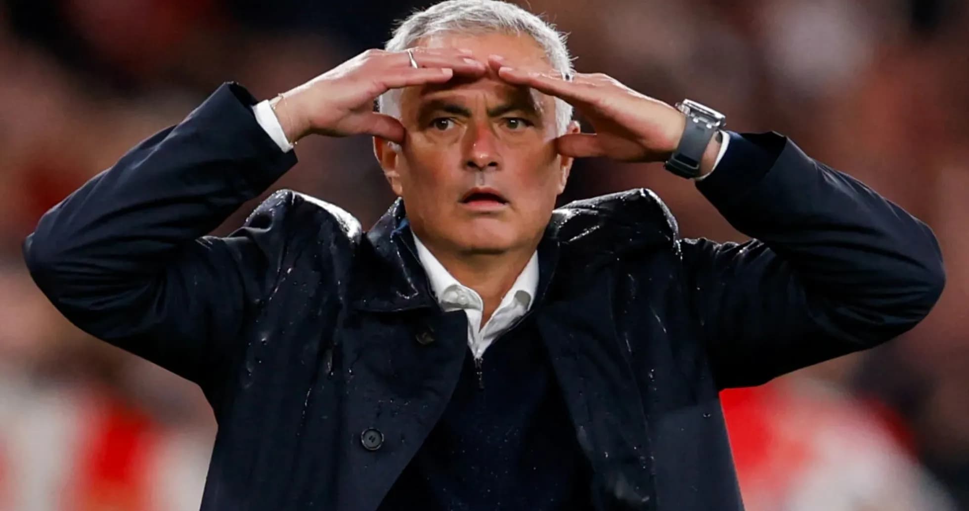 Manager gesturing during a tense moment in match