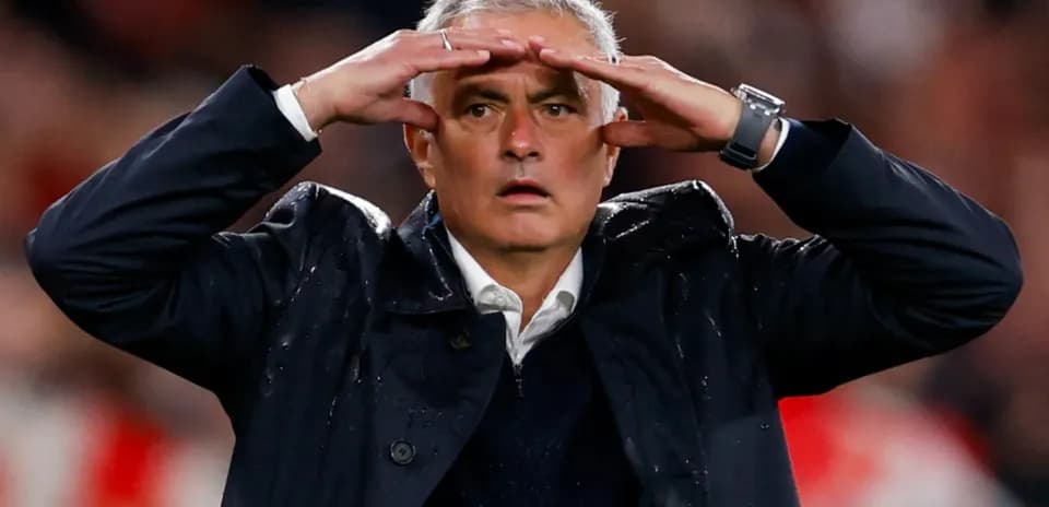 Manager gesturing during a tense moment in match