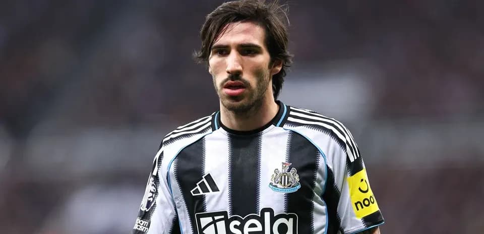 Player wearing Newcastle United jersey on the field