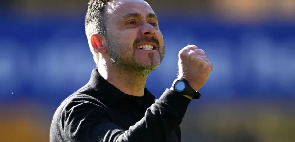 Coach celebrating a goal with clenched fist