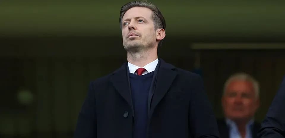 Man observing from the stands at a match