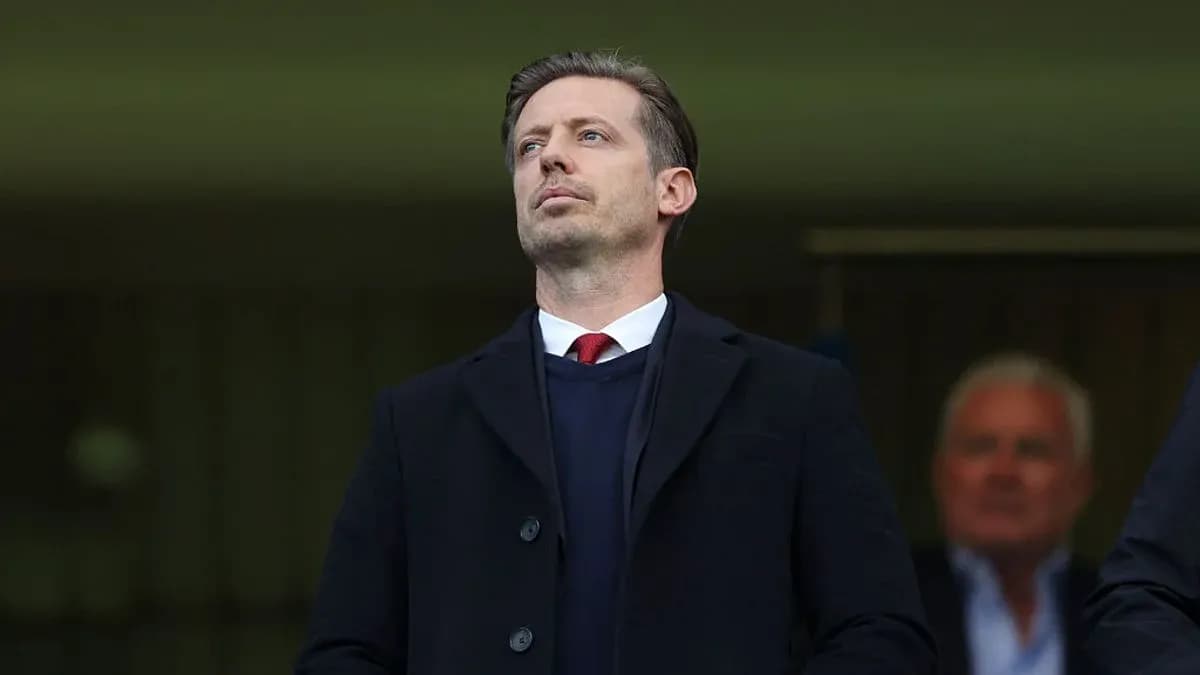 Man observing from the stands at a match