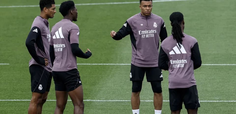 Players discussing during Real Madrid training session