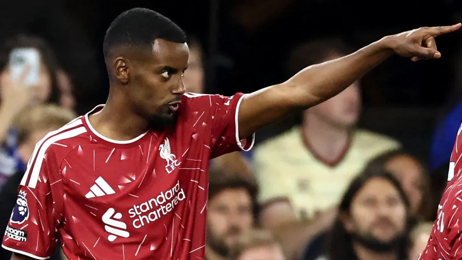 Player gesturing during Liverpool match on field