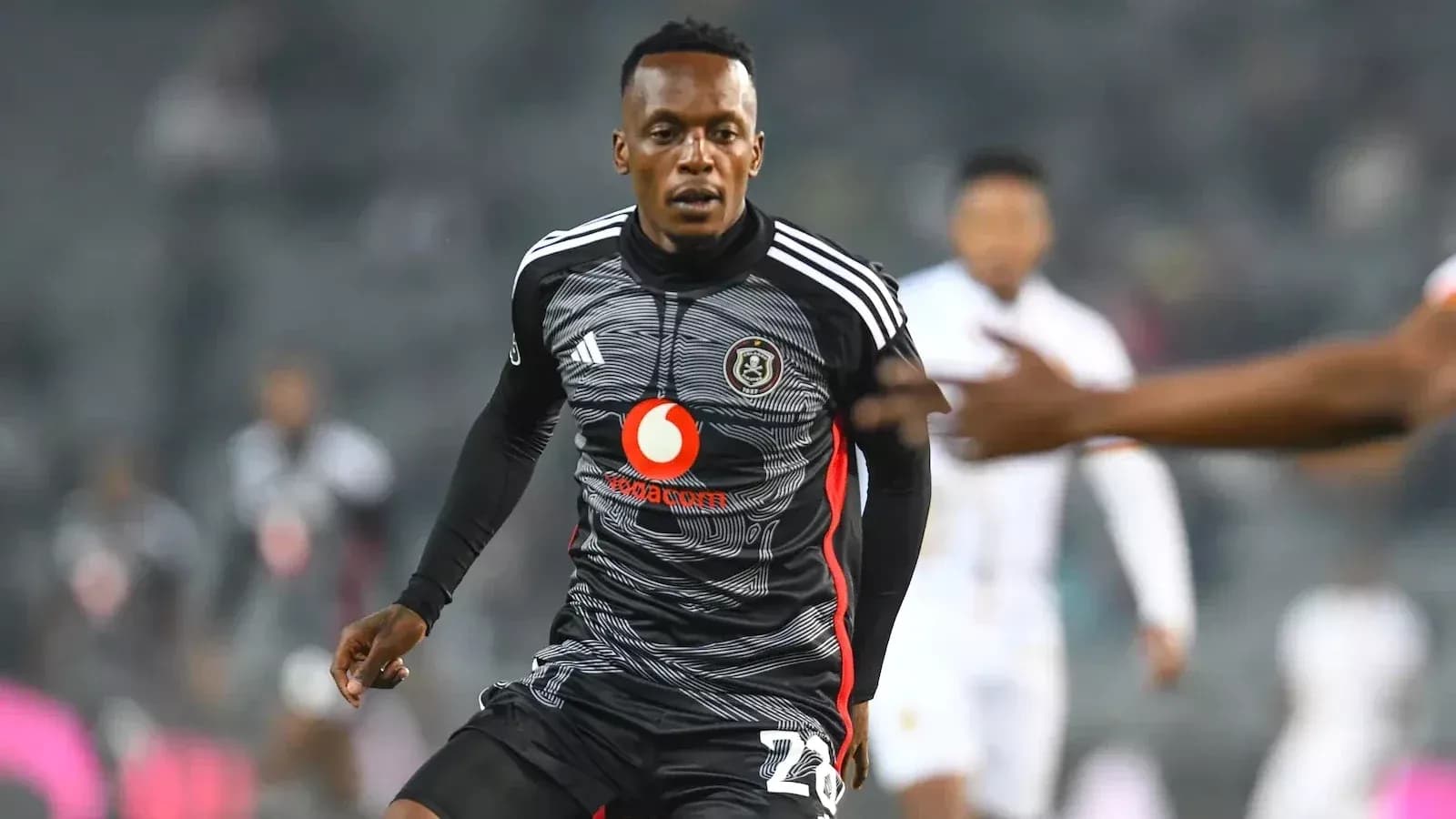 Player in black jersey during football match