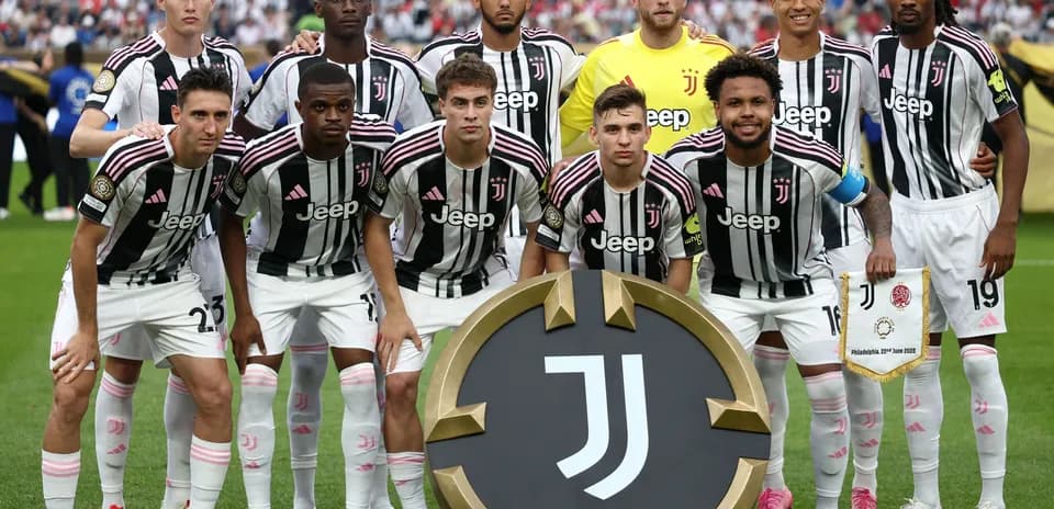 Juventus players posing with club emblem before match