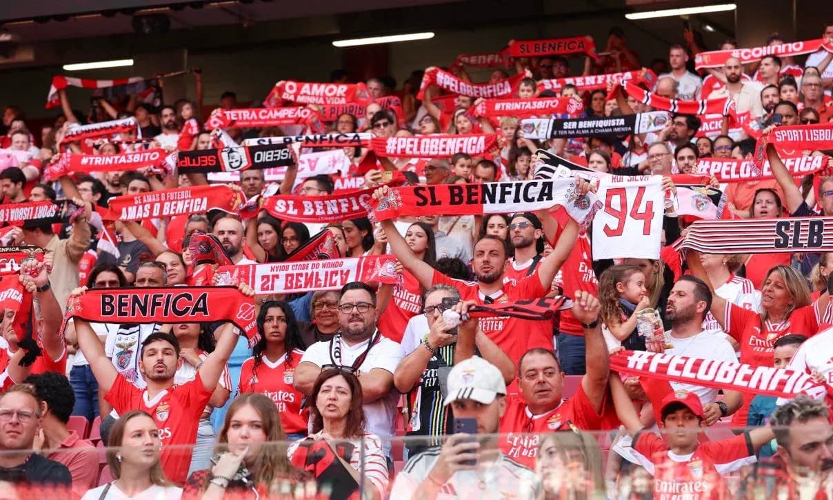 Benfica fans holding scarves in stadium