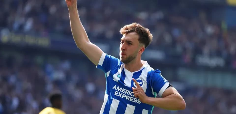 Player celebrating goal with raised finger at stadium