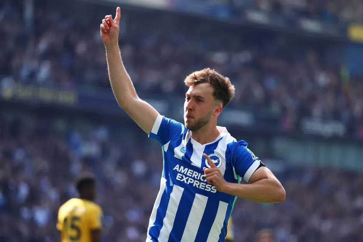 Player celebrating goal with raised finger at stadium