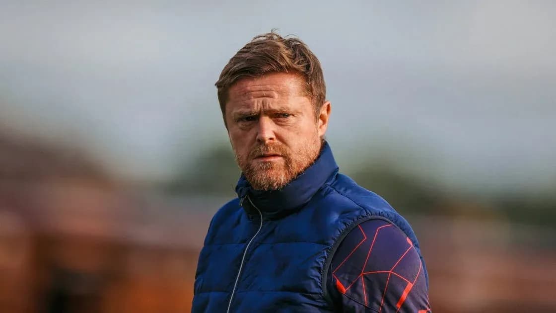 Coach observing training session at the pitch Coach observing training session at the pitch
