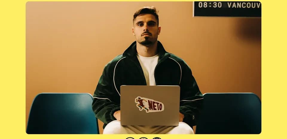 Man sitting with laptop in waiting area