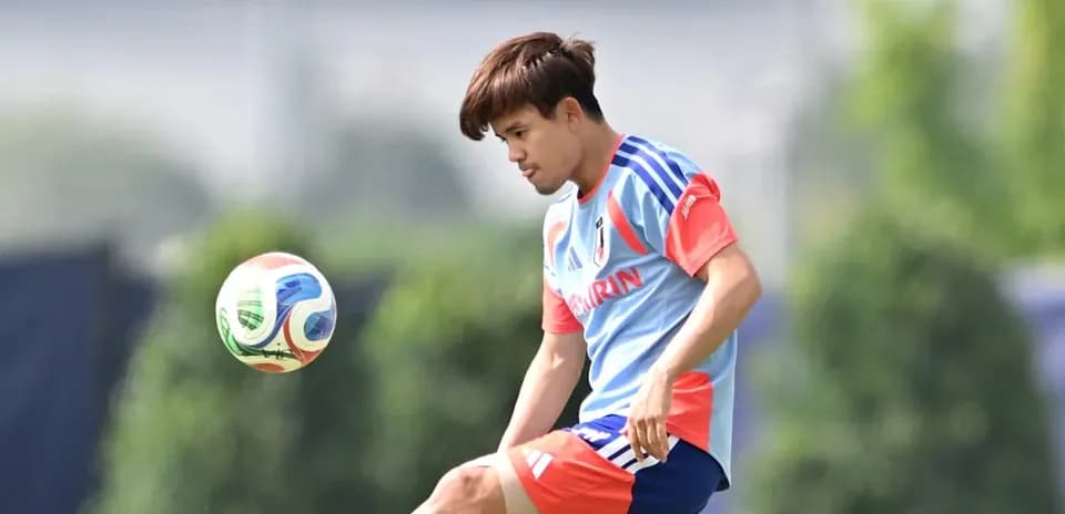 Player kicking a soccer ball during practice session