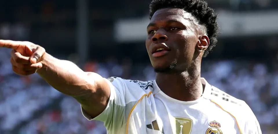 Player pointing during match in Real Madrid jersey