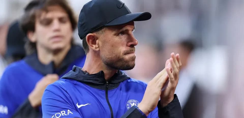 Coach applauding during match on the sidelines