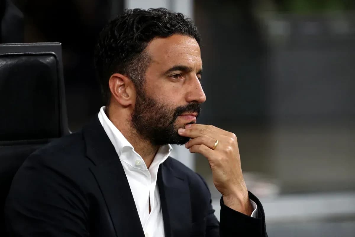 Man in suit contemplating during a match