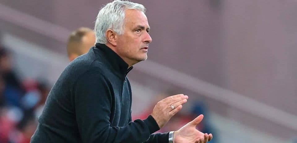 Manager gesturing on the sidelines during a match
