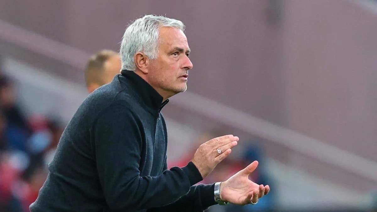 Manager gesturing on the sidelines during a match