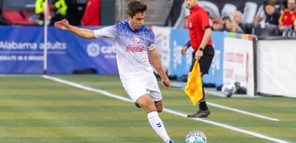 Player taking a corner kick during match