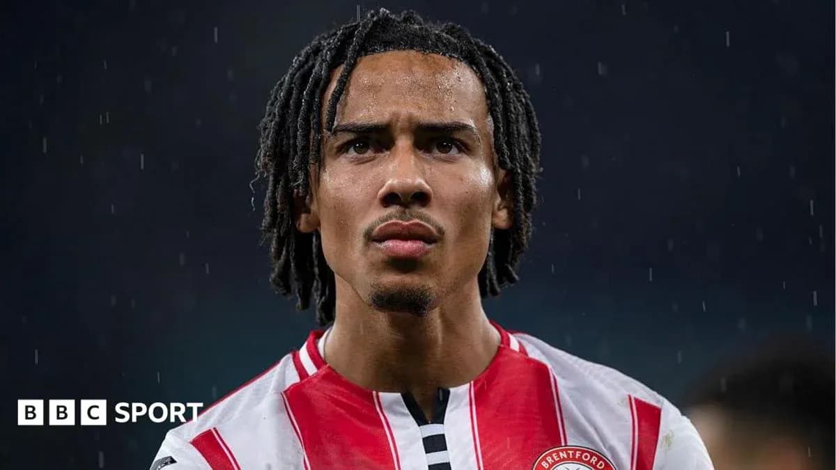 Brentford player in rain during match