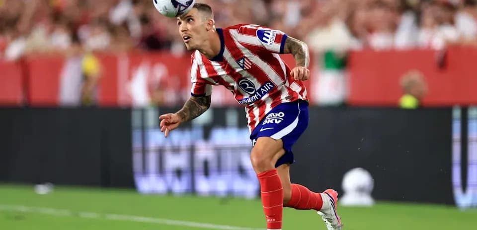 Player heading the ball during a football match
