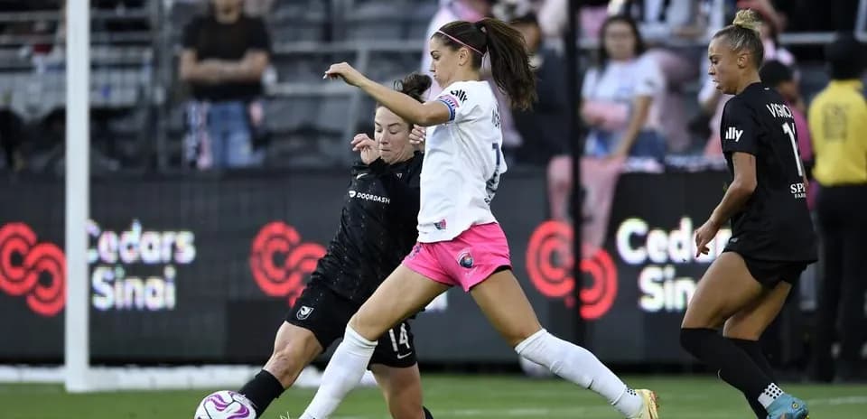 Players competing for the ball during match
