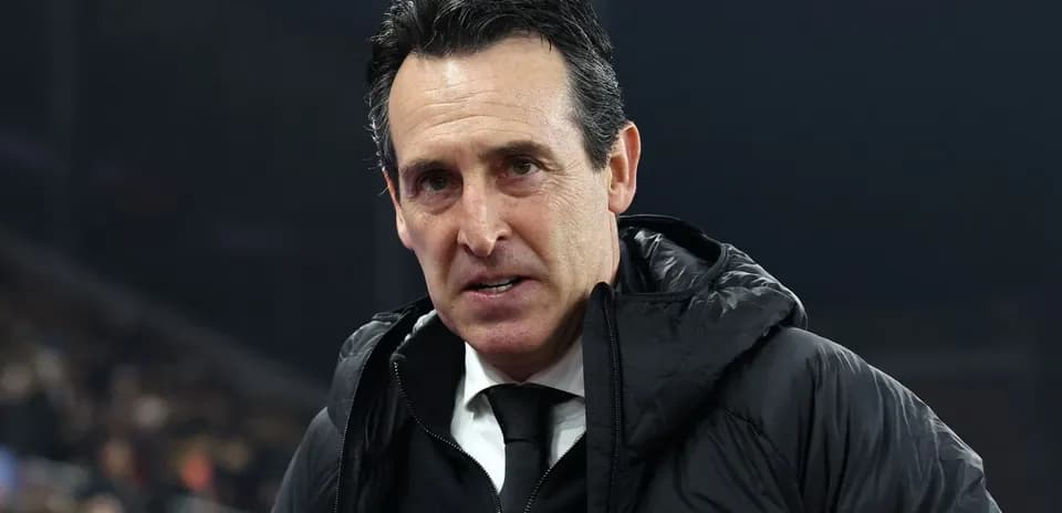 Football manager speaking during a match