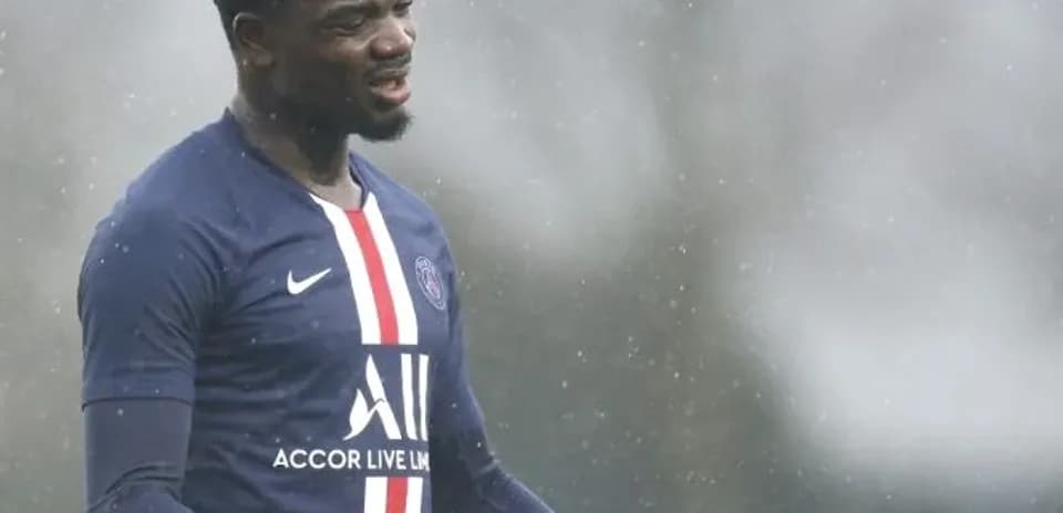 Player gesturing during training in rainy conditions