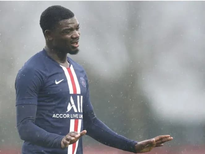 Player gesturing during training in rainy conditions