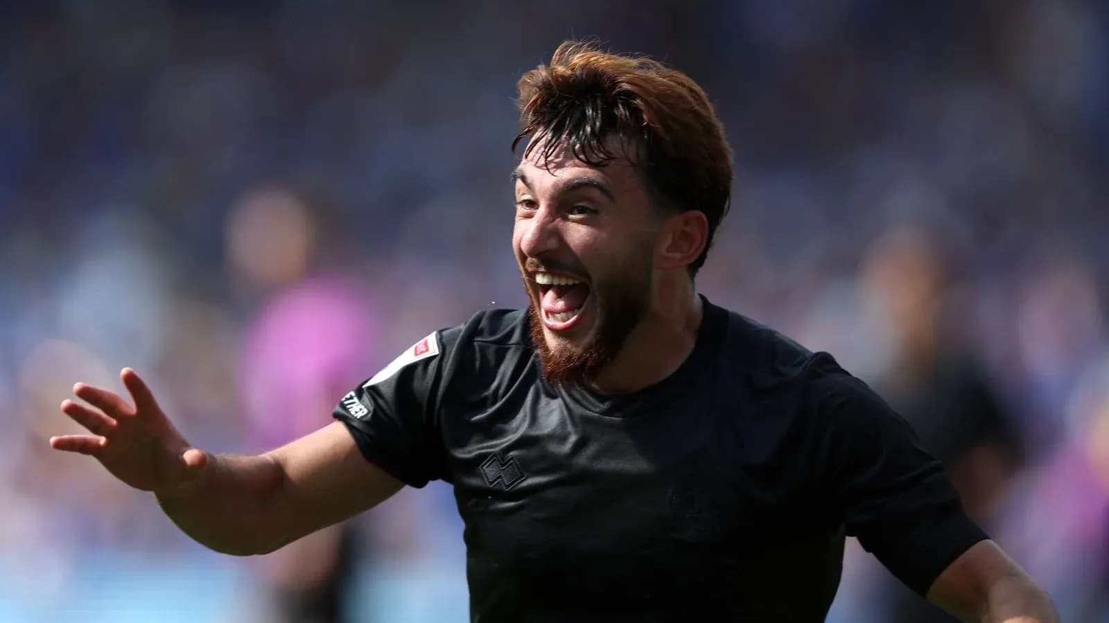 Player celebrating joyfully after scoring a goal